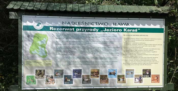 Tablica rezerwatu Jezioro Karaś na Pojezierzu Iławskim